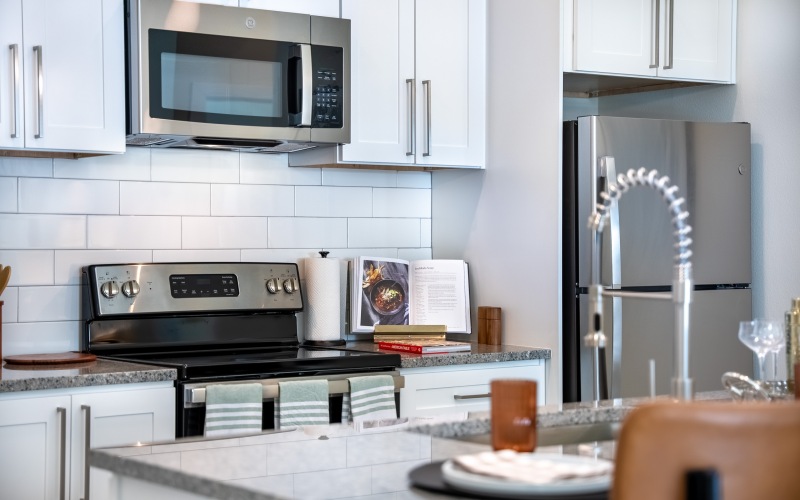 a kitchen with white cabinets